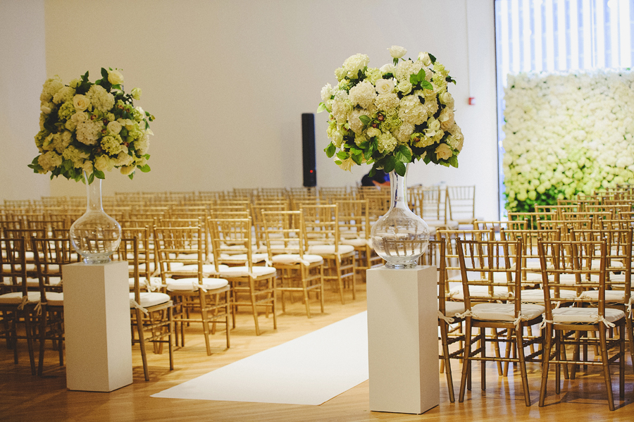 White and green flower wall for wedding ceremony by Yellow Canary Floral & Event Design