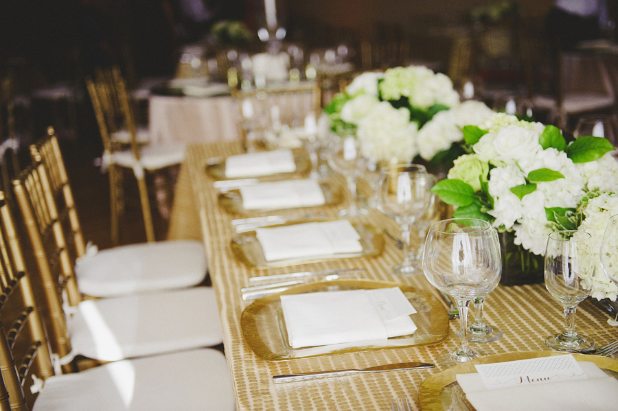 Table setting for white and green wedding ceremony by Yellow Canary Floral & Event Design