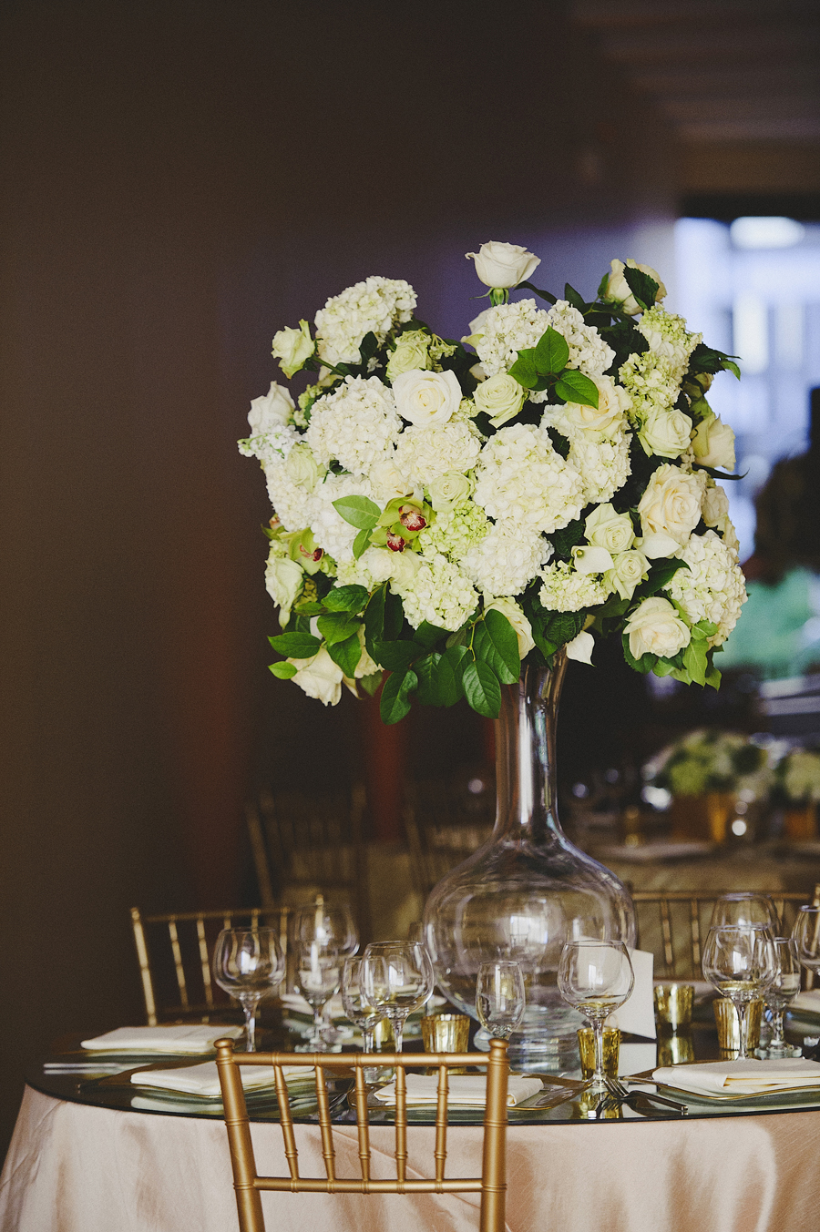 White and green focal arrangements for wedding ceremony by Yellow Canary Floral & Event Design