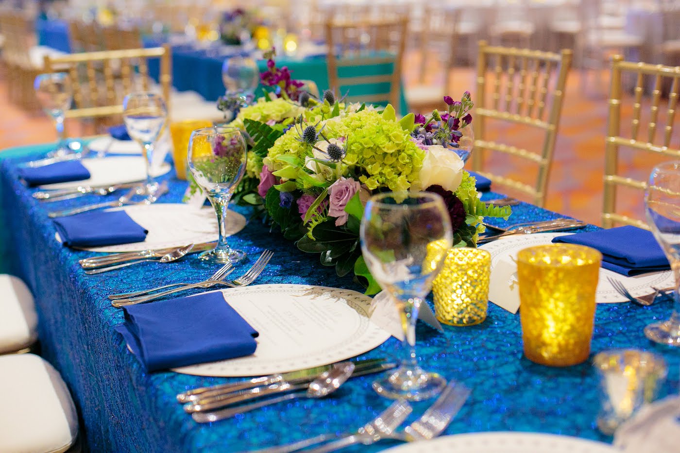 Rectangle short floral arrangement by Yellow Canary Floral & Event Design with rose, hydrangea and dusty miller for Health Carousel Gala