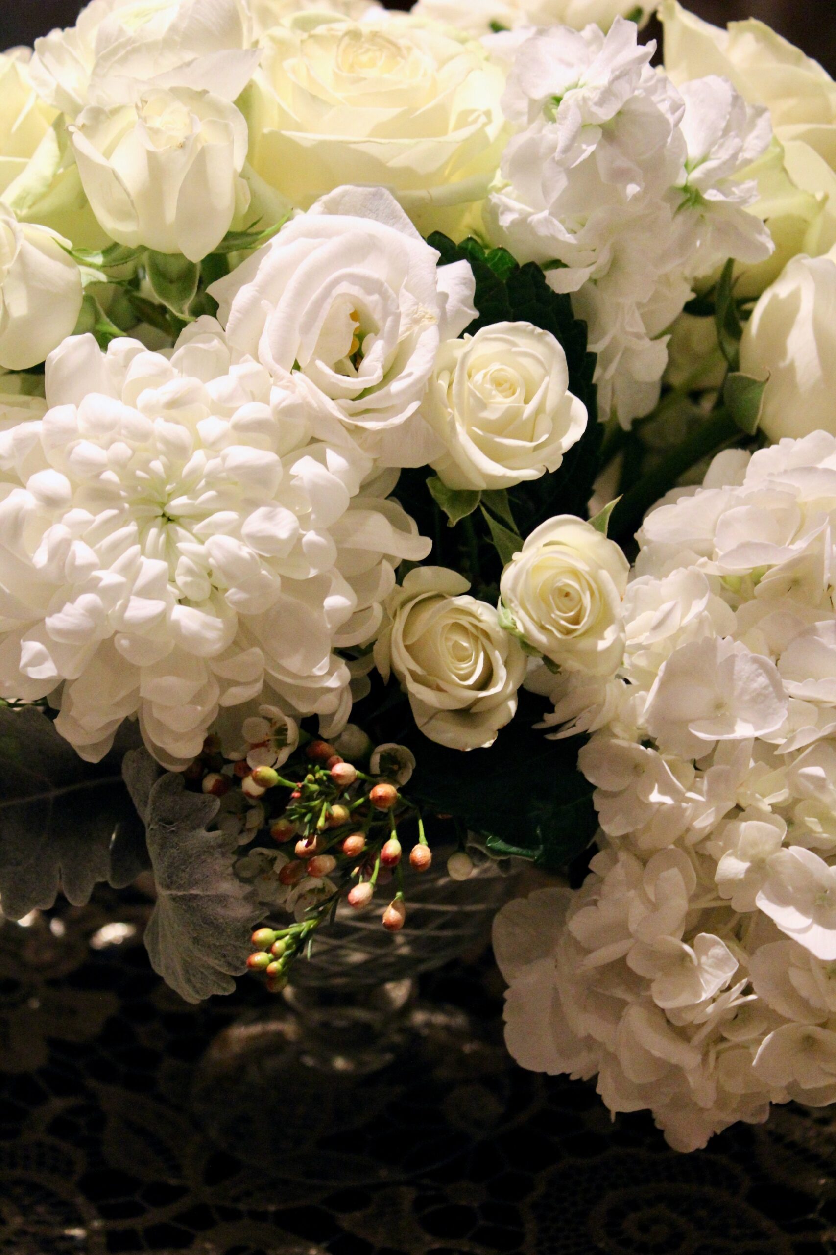 Meredith &amp; Elliot’s guests enjoyed a gorgeous reception in a room full of tall, focal arrangements full of white flowers and an assortment of greenery including eucalyptus and silvery lamb’s ear.