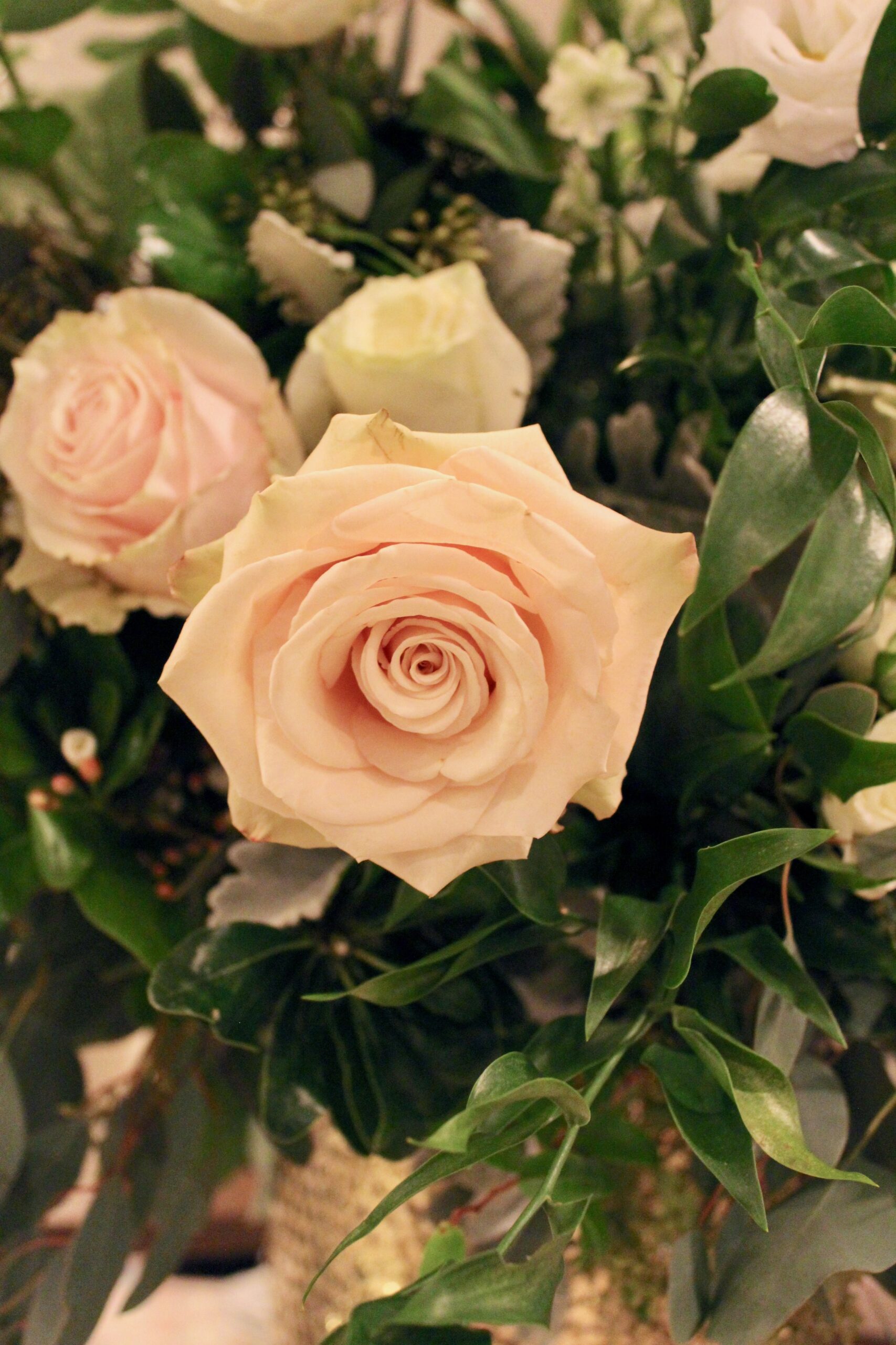 Meredith &amp; Elliot’s guests enjoyed a gorgeous reception in a room full of tall, focal arrangements full of white flowers and an assortment of greenery including eucalyptus and silvery lamb’s ear.