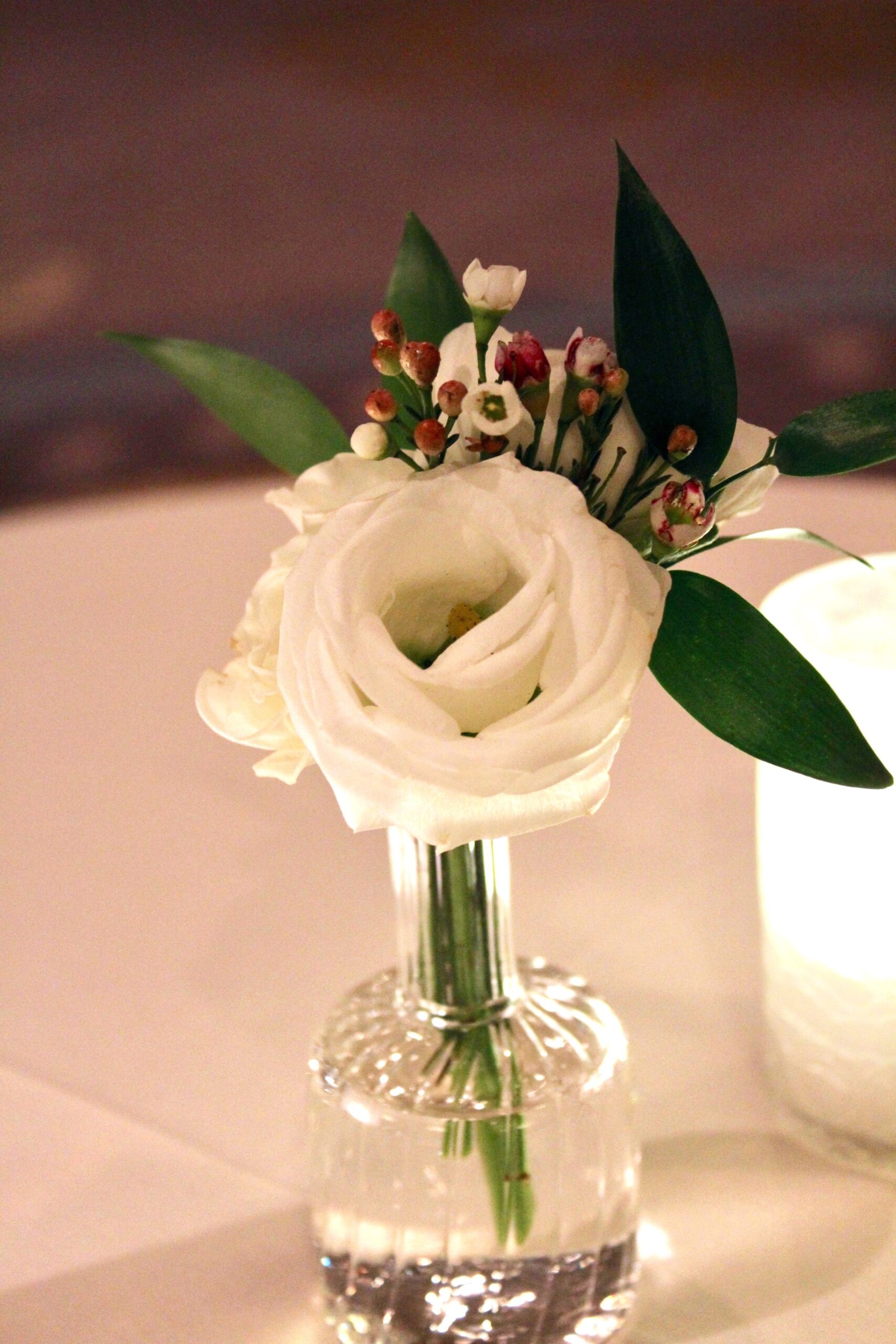 Meredith &amp; Elliot’s guests enjoyed a gorgeous reception in a room full of tall, focal arrangements full of white flowers and an assortment of greenery including eucalyptus and silvery lamb’s ear.