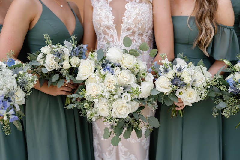 Cincinnati wedding party in sage with green and white florals at Mohave East