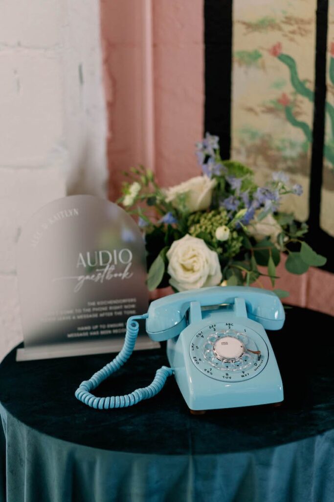 Welcome table with blue telephone for Mohave East wedding